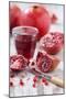 Whole and Sliced Pomegranates, Knives, Glass with Pomegranate Juice-Jana Ihle-Mounted Photographic Print