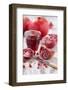 Whole and Sliced Pomegranates, Knives, Glass with Pomegranate Juice-Jana Ihle-Framed Photographic Print