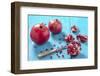 Whole and Sliced Pomegranates on Turquoise Wooden Table-Jana Ihle-Framed Photographic Print