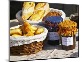 Wicker Basket with Croissants and Breads, Clos Des Iles, Le Brusc, Var, Cote d'Azur, France-Per Karlsson-Mounted Photographic Print