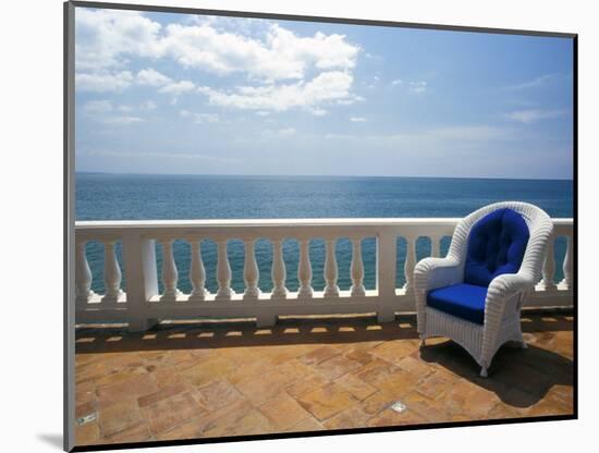 Wicker Chair and Tiled Terrace at the Hornet Dorset Primavera Hotel, Puerto Rico-Michele Molinari-Mounted Photographic Print