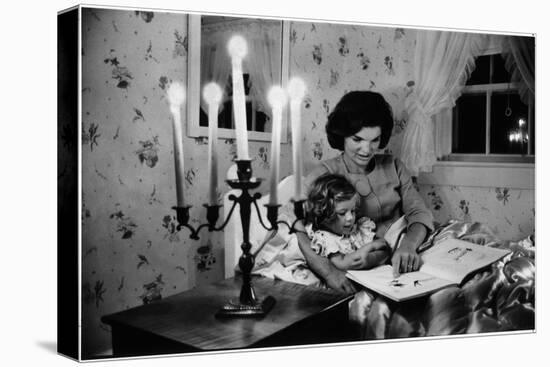 Wife of Senator Jackie Kennedy Reading Book to Her Daughter Caroline In Family's summer home-Alfred Eisenstaedt-Stretched Canvas