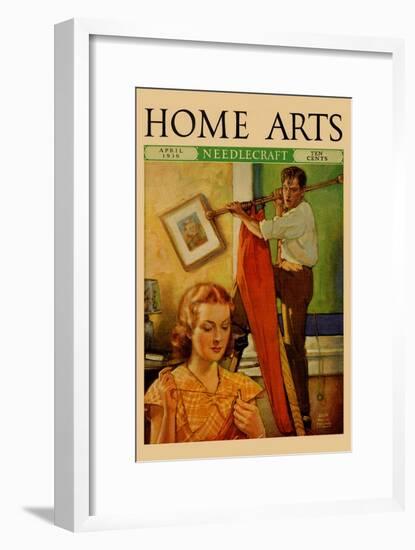 Wife Sews While a Man Hangs a Picture-null-Framed Art Print