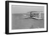 Wilbur Wright in damaged plane after unsuccesful flight Photograph - Kitty Hawk, NC-Lantern Press-Framed Art Print