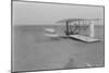 Wilbur Wright in damaged plane after unsuccesful flight Photograph - Kitty Hawk, NC-Lantern Press-Mounted Art Print