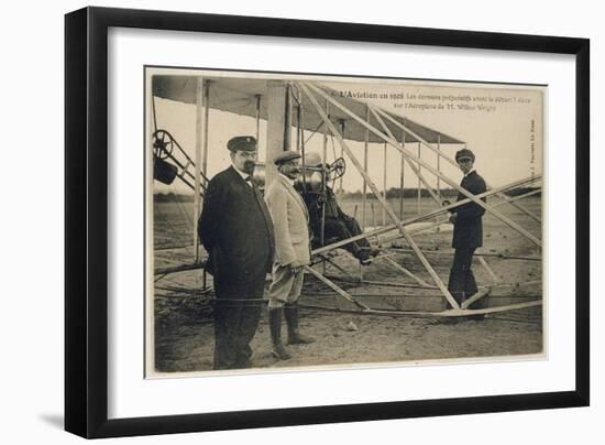 Wilbur Wright Makes a Last Minute Check Before Taking to the Air with a Passenger-null-Framed Art Print