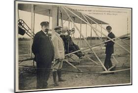 Wilbur Wright Makes a Last Minute Check Before Taking to the Air with a Passenger-null-Mounted Art Print