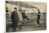 Wilbur Wright Makes a Last Minute Check Before Taking to the Air with a Passenger-null-Mounted Premium Giclee Print