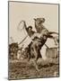 Wild West Show Performer Holds Aloft A Coiled Rope As His Horse Rears Up On His Hind Feet.-null-Mounted Art Print