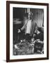 Willem de Kooning Preparing to Drink a Cup of Coffee in His East 10th St. Studio-James Burke-Framed Premium Photographic Print