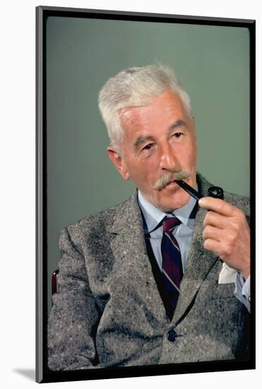 William Faulkner Smoking a Pipe-Carl Mydans-Mounted Photographic Print