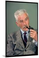 William Faulkner Smoking a Pipe-Carl Mydans-Mounted Photographic Print