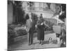 William Randolph Hearst and Mrs. Burton Holmes at San Simeon Estate with Boston Bull Terrier-William Davis-Mounted Premium Photographic Print