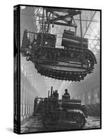 Winching a Tank with an Overhead Crane at a Factory in St. Petersburg-null-Stretched Canvas