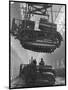 Winching a Tank with an Overhead Crane at a Factory in St. Petersburg-null-Mounted Art Print