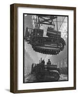 Winching a Tank with an Overhead Crane at a Factory in St. Petersburg-null-Framed Art Print