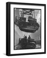 Winching a Tank with an Overhead Crane at a Factory in St. Petersburg-null-Framed Art Print