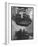 Winching a Tank with an Overhead Crane at a Factory in St. Petersburg-null-Framed Art Print