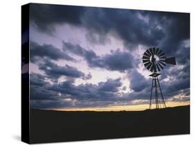 Windmill Silhouette under Broken Clouds-James Randklev-Stretched Canvas