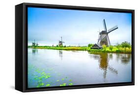Windmills and Canal in Kinderdijk, Holland or Netherlands. Unesco Site-stevanzz-Framed Stretched Canvas