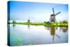 Windmills and Canal in Kinderdijk, Holland or Netherlands. Unesco Site-stevanzz-Stretched Canvas