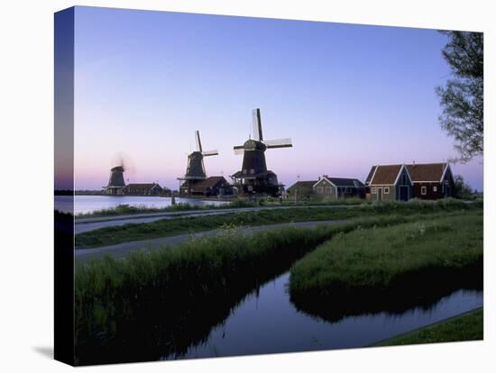 Windmills at Sunset, Zaanstad, North Holland-Walter Bibikow-Stretched Canvas