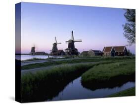 Windmills at Sunset, Zaanstad, North Holland-Walter Bibikow-Stretched Canvas