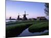 Windmills at Sunset, Zaanstad, North Holland-Walter Bibikow-Mounted Photographic Print