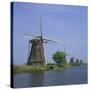 Windmills on the Canal at Kinderdijk Near Rotterdam, UNESCO World Heritage Site, the Netherlands-Roy Rainford-Stretched Canvas