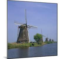 Windmills on the Canal at Kinderdijk Near Rotterdam, UNESCO World Heritage Site, the Netherlands-Roy Rainford-Mounted Photographic Print