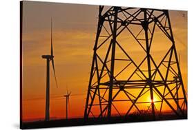 Windmills, pylon and power lines in morning light, Germany, Europe-Hans-Peter Merten-Stretched Canvas