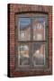 Window in a rowhouse in Wislica, Poland with reflections from the home across the street.-Mallorie Ostrowitz-Stretched Canvas