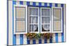 Window of a Traditional Striped Painted House in the Little Seaside Village of Costa Nova, Portugal-Mauricio Abreu-Mounted Photographic Print