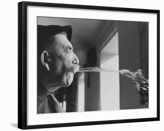 Wine Cellar Master and Taster Spitting Wine-Carlo Bavagnoli-Framed Photographic Print