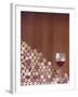 Wine Corks, Piled Up, and a Glass of Red Wine-Henrik Freek-Framed Photographic Print