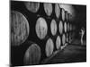 Winery Worker Checking Barrels of Wine-null-Mounted Photographic Print