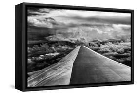 Wing of Airplane Flying in Mid-Air under and Between Clouds-Liyun Yu-Framed Stretched Canvas