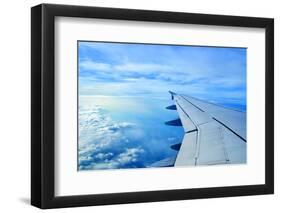 Wing of an Airplane Flying Above the Clouds-ghoststone-Framed Photographic Print