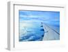 Wing of an Airplane Flying Above the Clouds-ghoststone-Framed Photographic Print