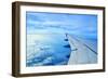 Wing of an Airplane Flying Above the Clouds-ghoststone-Framed Photographic Print