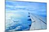 Wing of an Airplane Flying Above the Clouds-ghoststone-Mounted Photographic Print