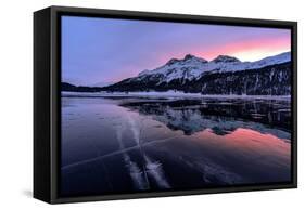Winter sunrise on snowcapped mountains mirrored in the icy Lake Silvaplana, Maloja-Roberto Moiola-Framed Stretched Canvas