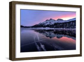 Winter sunrise on snowcapped mountains mirrored in the icy Lake Silvaplana, Maloja-Roberto Moiola-Framed Photographic Print