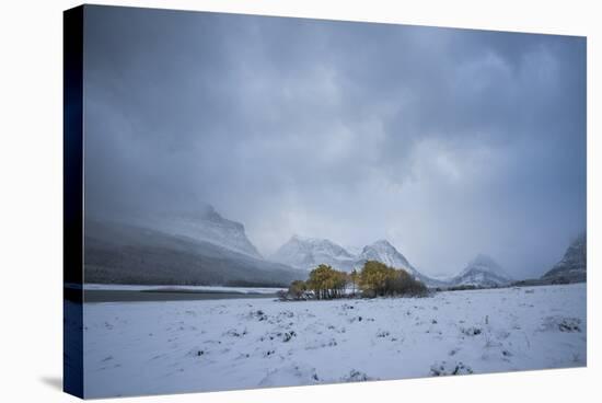 Winter Sunset over Glacier National Park, Montana-Steven Gnam-Stretched Canvas