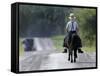 With a Buggy Approaching in the Distance, an Amish Boy Heads Down a Country Road on His Pony-Amy Sancetta-Framed Stretched Canvas