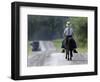 With a Buggy Approaching in the Distance, an Amish Boy Heads Down a Country Road on His Pony-Amy Sancetta-Framed Photographic Print