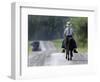 With a Buggy Approaching in the Distance, an Amish Boy Heads Down a Country Road on His Pony-Amy Sancetta-Framed Photographic Print