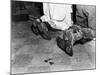 With Soiled Army Boots, a Chaplain and Soldier Kneel at Catholic Mass Is Held for Two Dead Soldiers-null-Mounted Photo