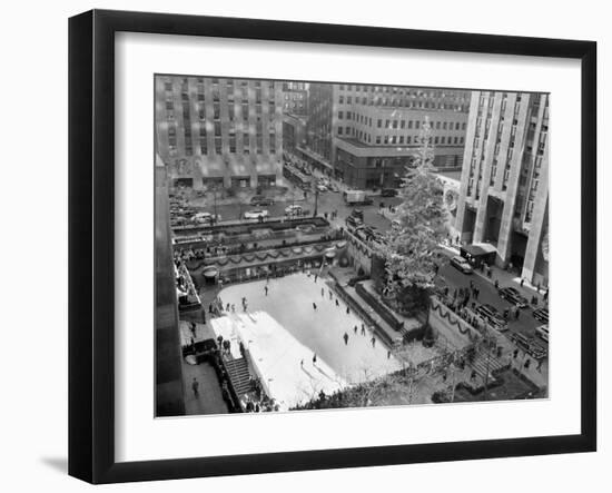 With the Famed Rockefeller Center Christmas Tree Rising Above Them, Skaters Glide on the Ice-null-Framed Premium Photographic Print
