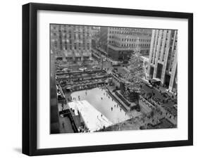 With the Famed Rockefeller Center Christmas Tree Rising Above Them, Skaters Glide on the Ice-null-Framed Premium Photographic Print